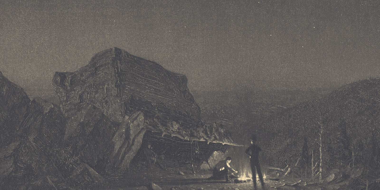 Nighttime mountain campsite beneath a dark sky